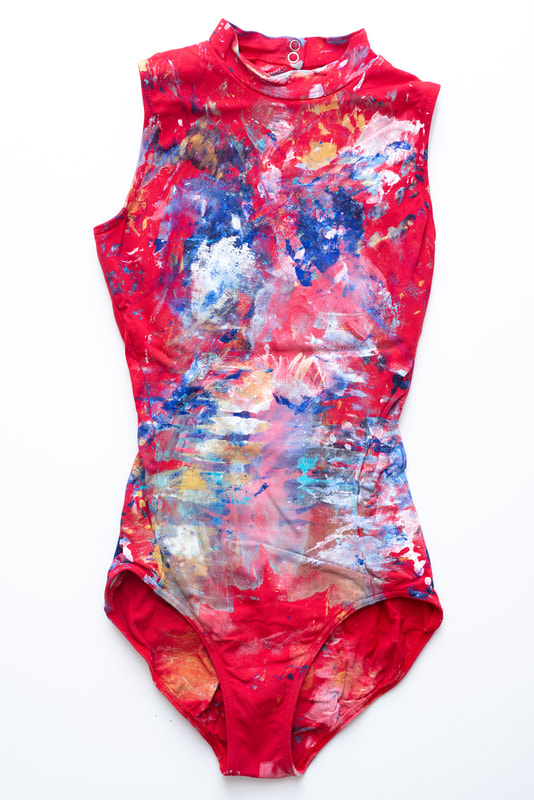 Red Bodysuit (Blues, White, Gold paint). 2019. This performance artifact was created through a live performance painting in Evora, Portugal. I was the artist in residence for an international live arts festival and performed for the community. (Custom Framed)
